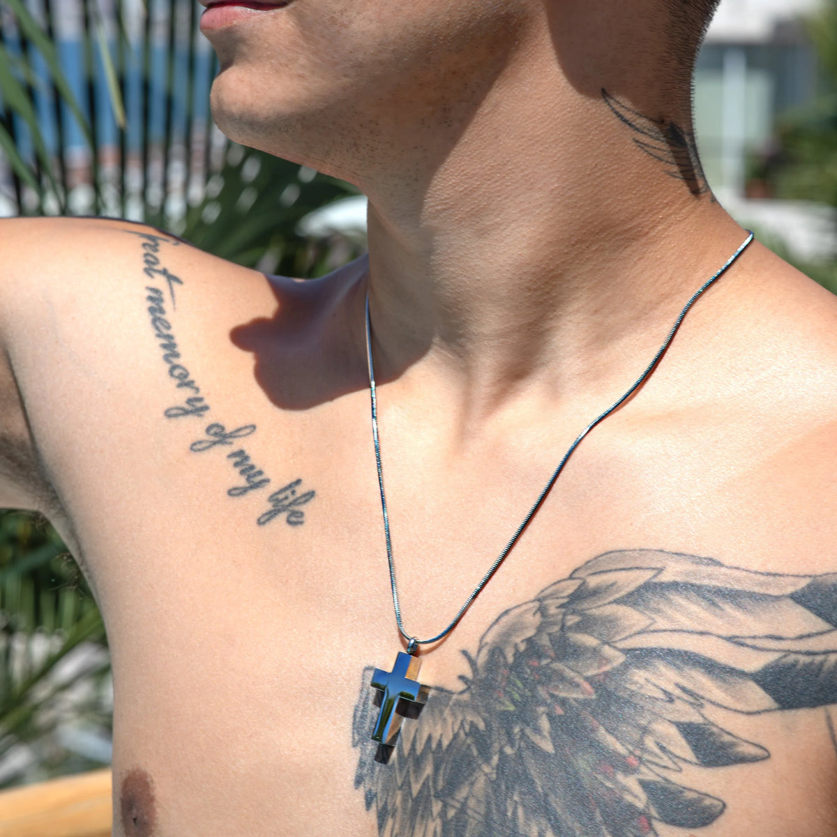 Blue crystal pendant hanging from a silver chain necklace.