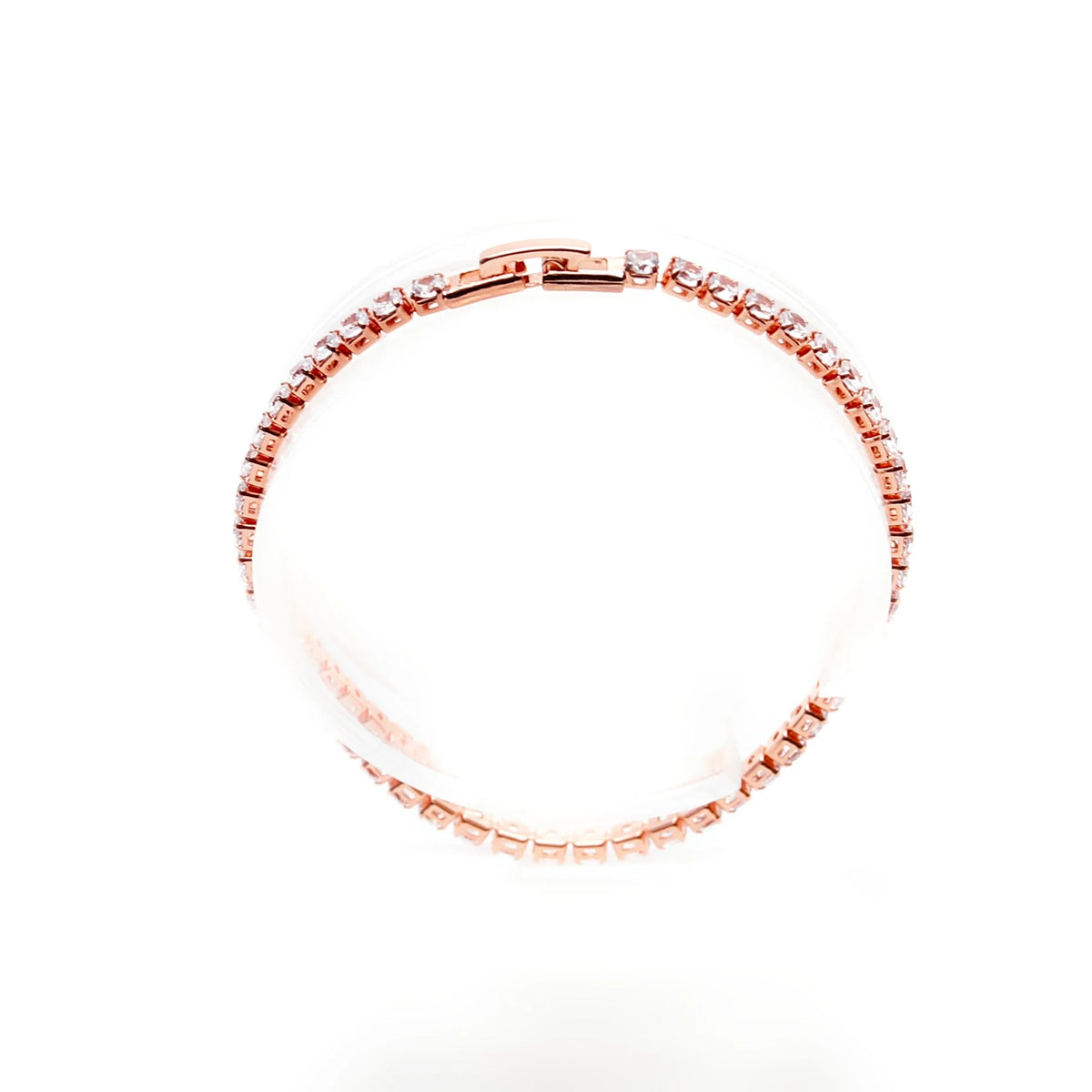 Rose gold tennis bracelet with diamond-like stones.