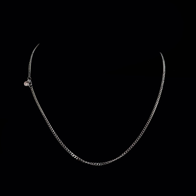 Simple silver chain necklace with a delicate curb link design.