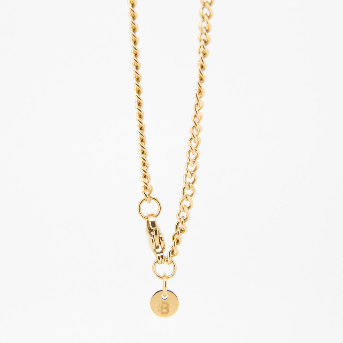 Gold-toned chain necklace with a circular pendant.