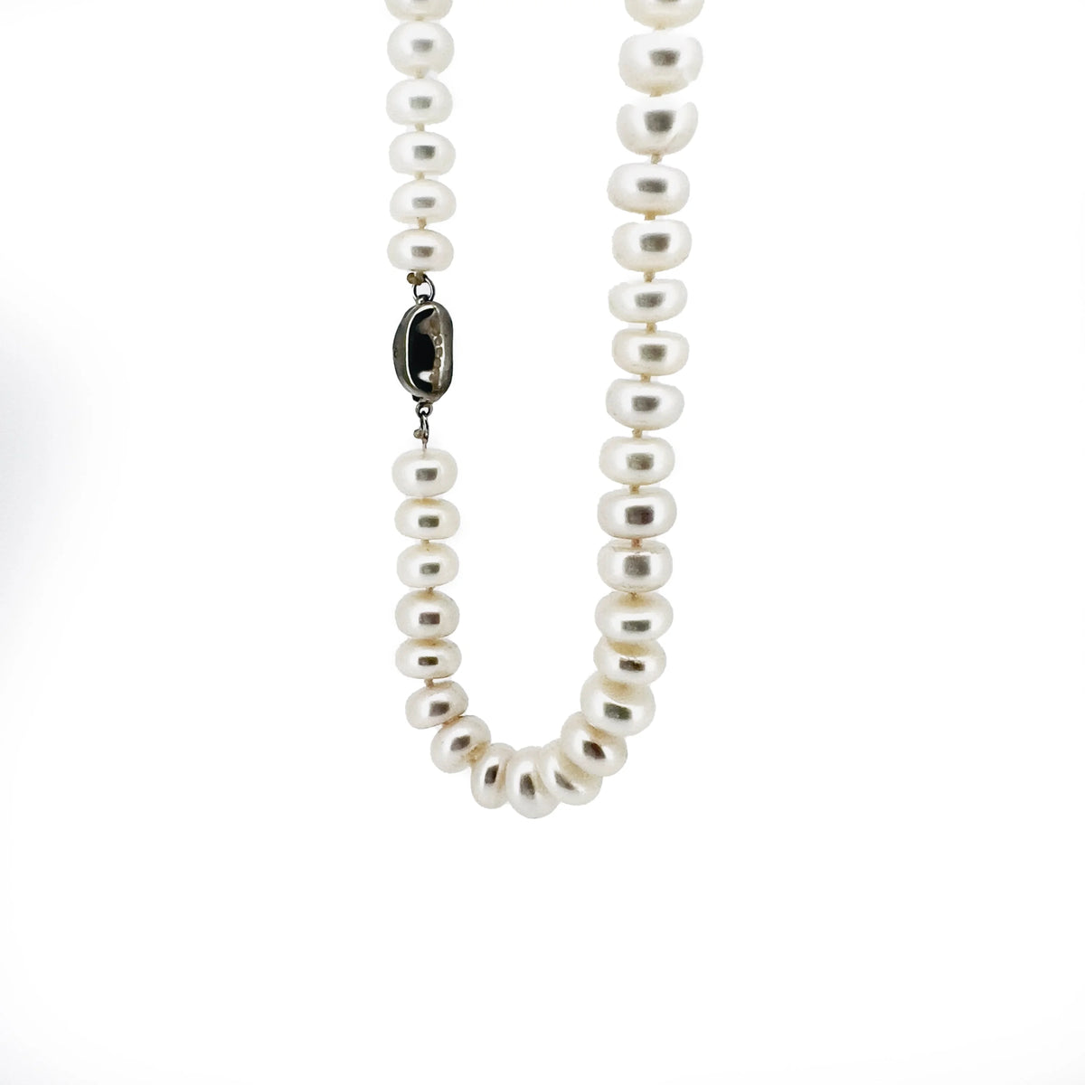 Pearl necklace with a dark metal clasp.