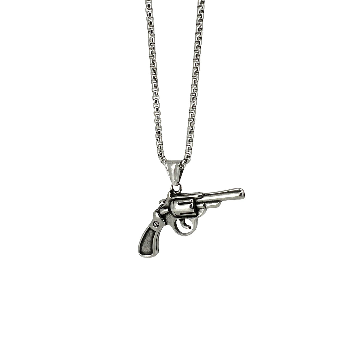 Silver necklace with a revolver-shaped pendant.