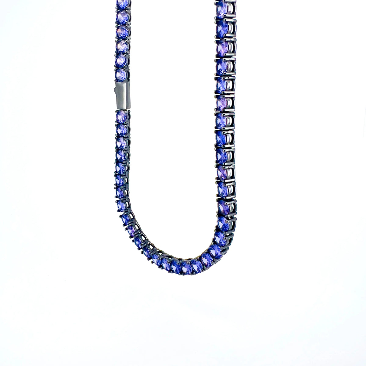 Blue gemstone tennis necklace with a silver clasp.