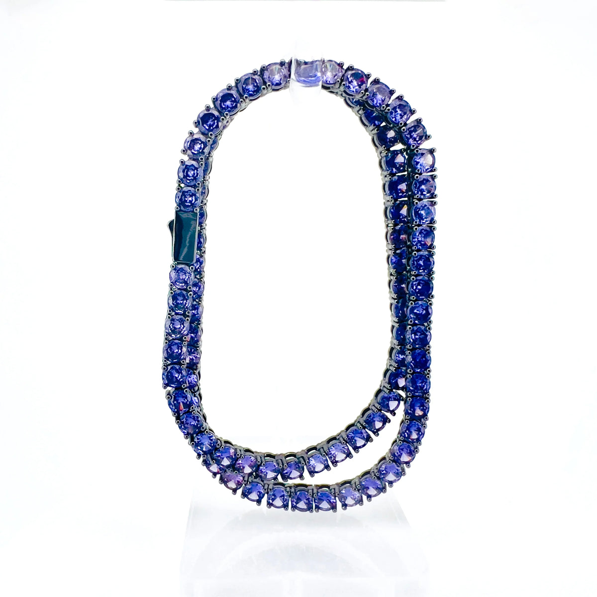 Elegant blue gemstone necklace with two strands of sparkling stones.