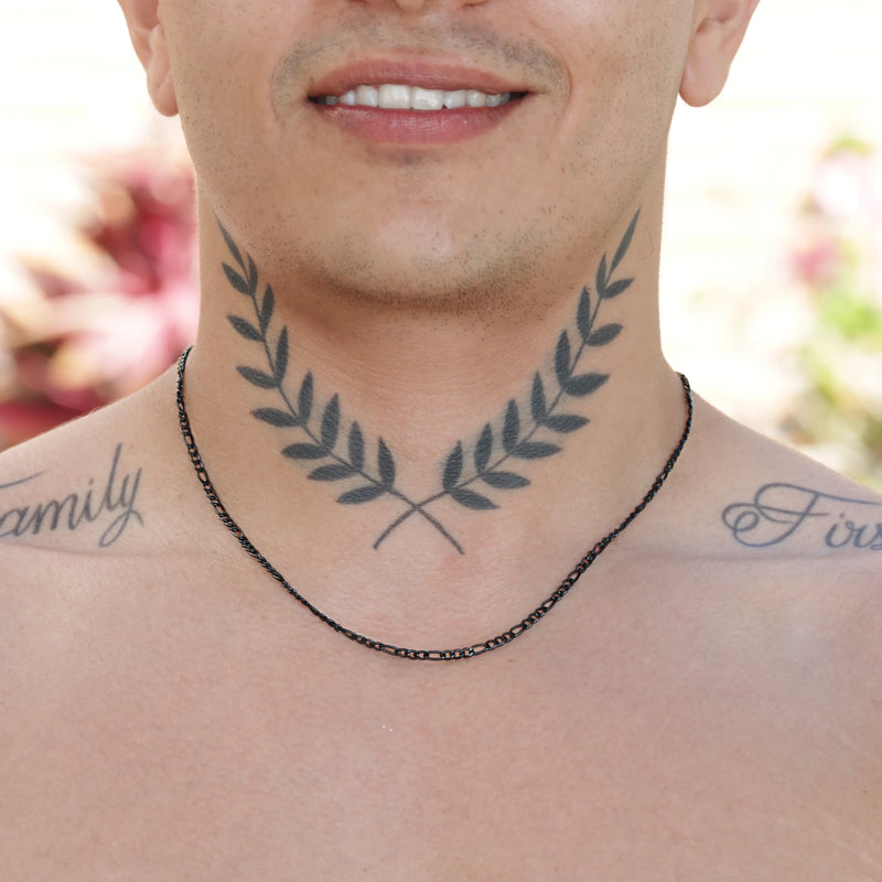 Neck tattoo of symmetrical laurel branches crossing at the bottom.