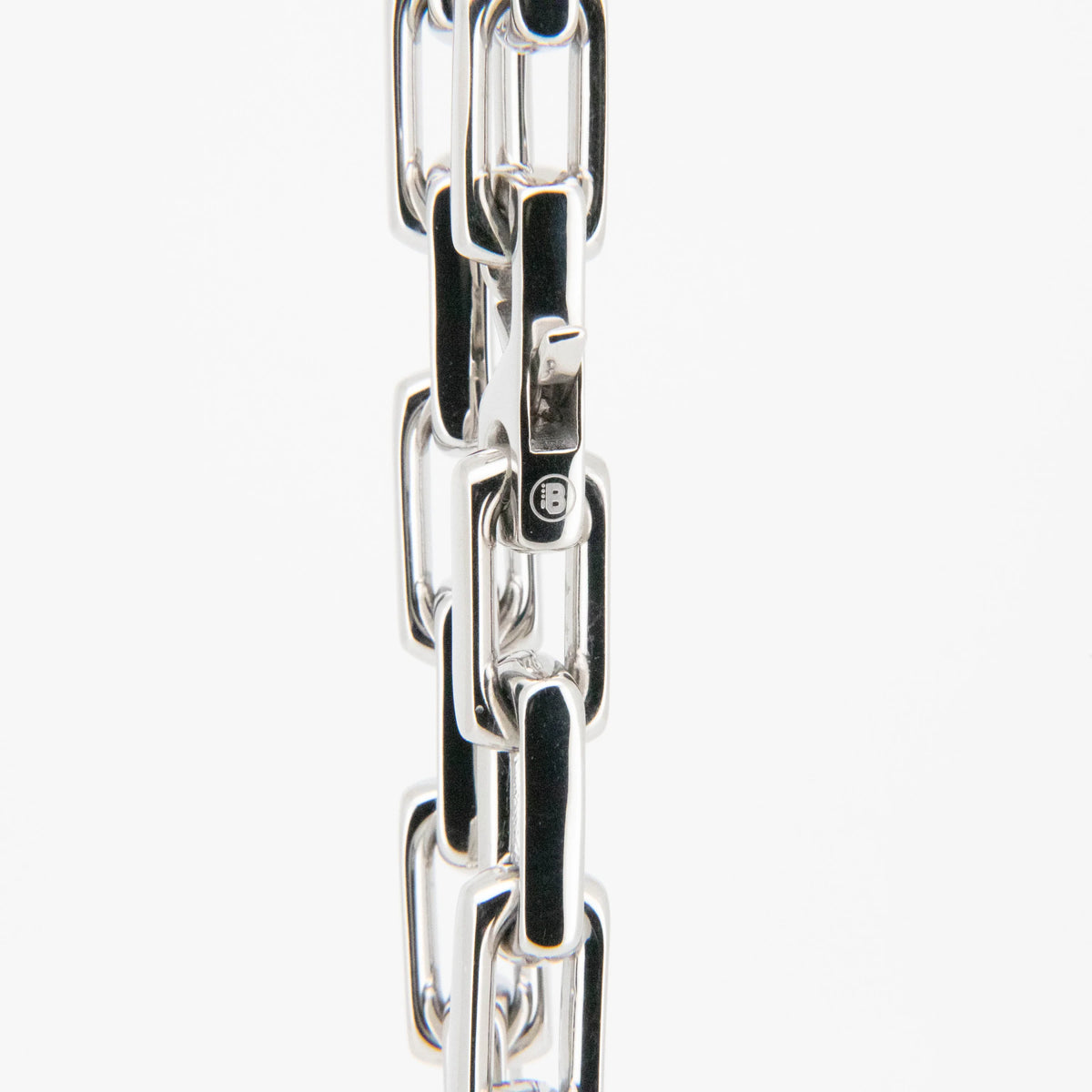 Silver metal chain with rectangular links.