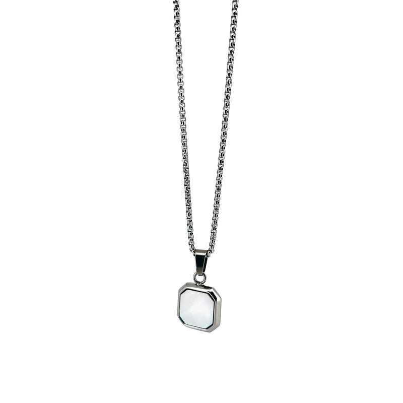 Silver necklace with a square pendant featuring a white inlay or stone.