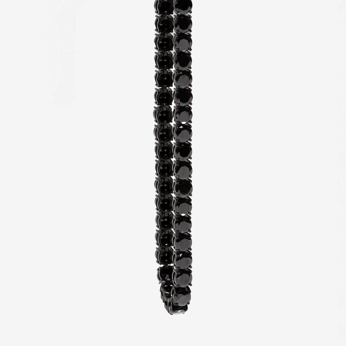Black gemstone tennis bracelet.