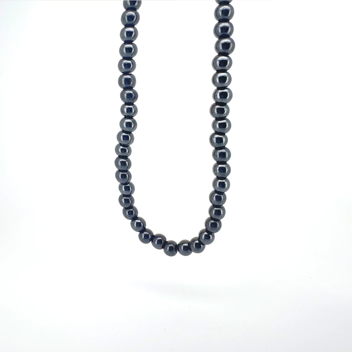 String of dark metallic beads forming a necklace.