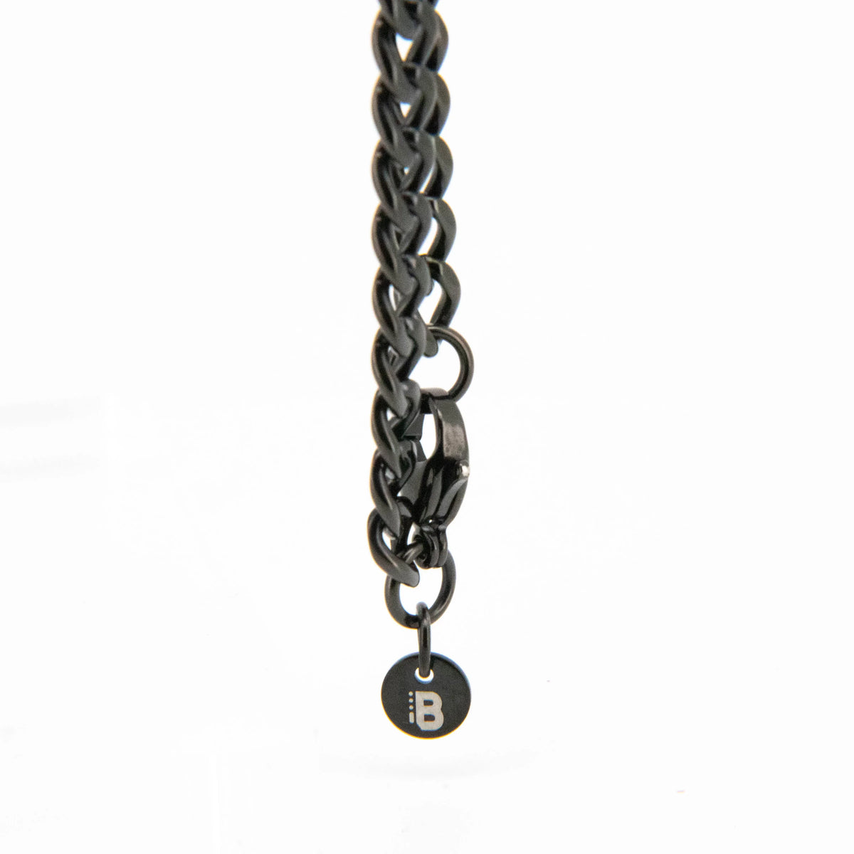 Dark metallic chain with a circular pendant.