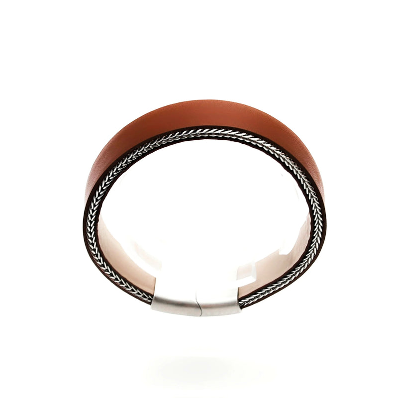 Curved brown leather bracelet with decorative silver trim along the edges.