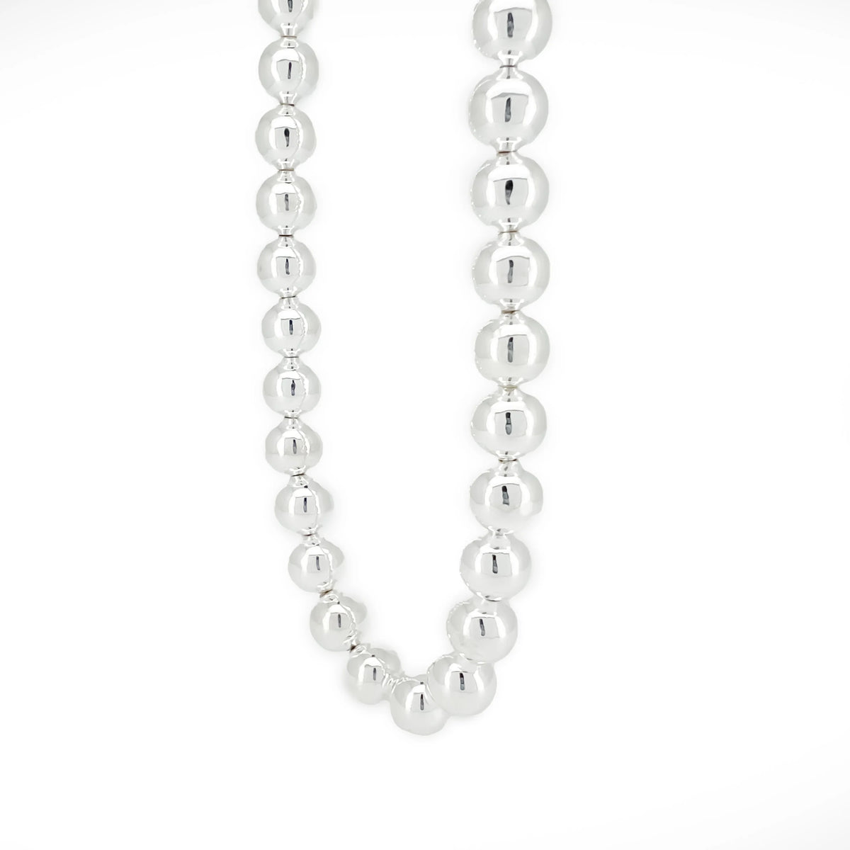 Silver bead necklace with uniformly sized spherical beads.