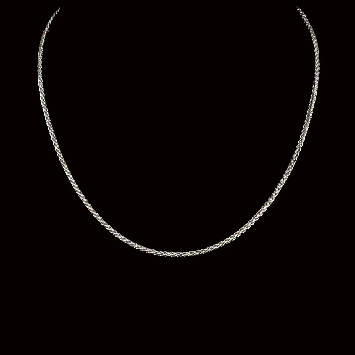 Silver braided chain necklace.