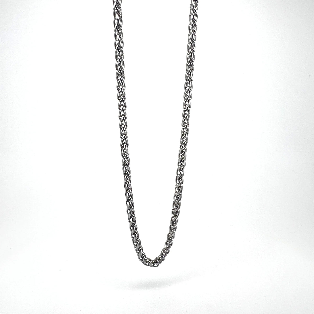 Silver chain necklace with an interwoven rope-like pattern.