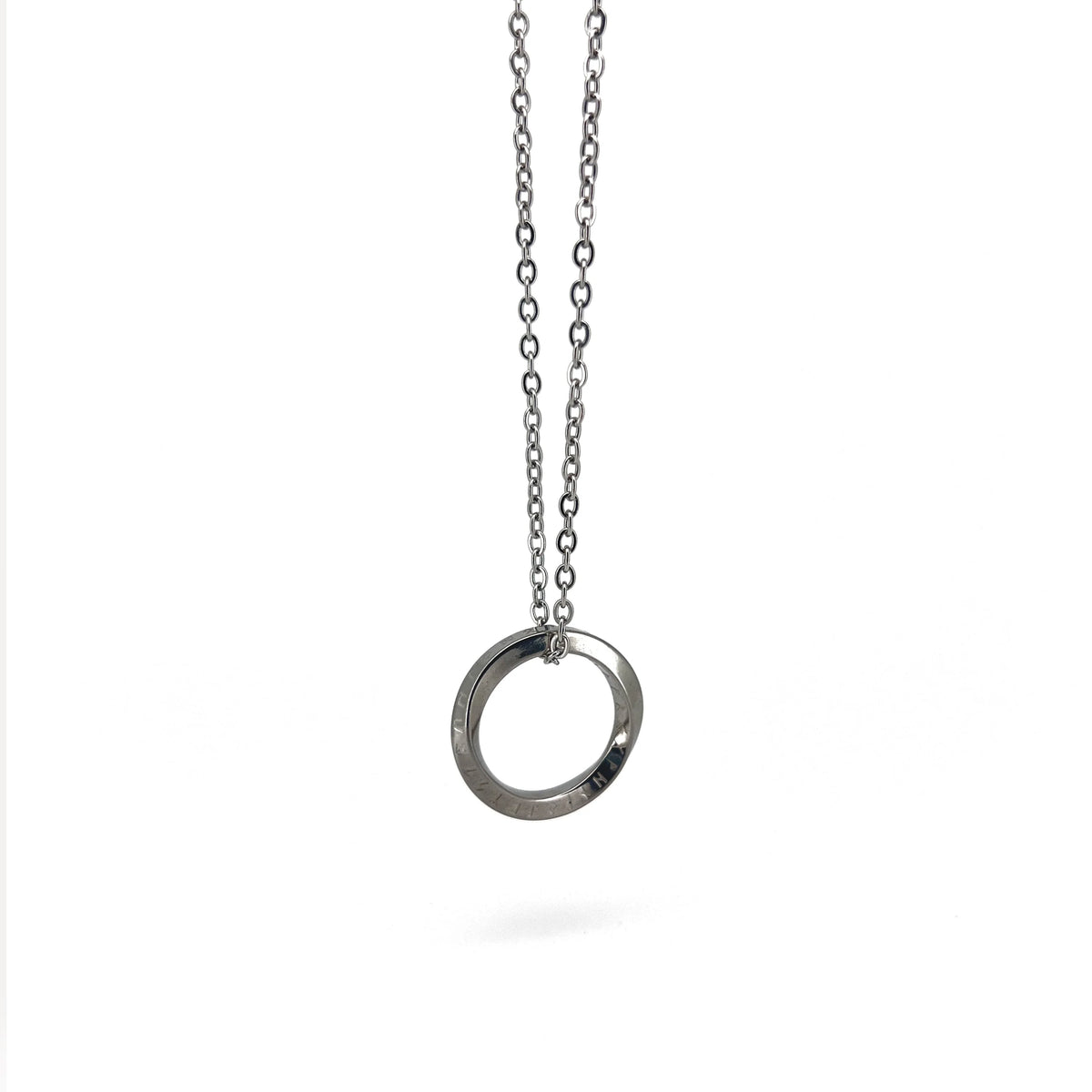 Silver circular pendant necklace on a chain.