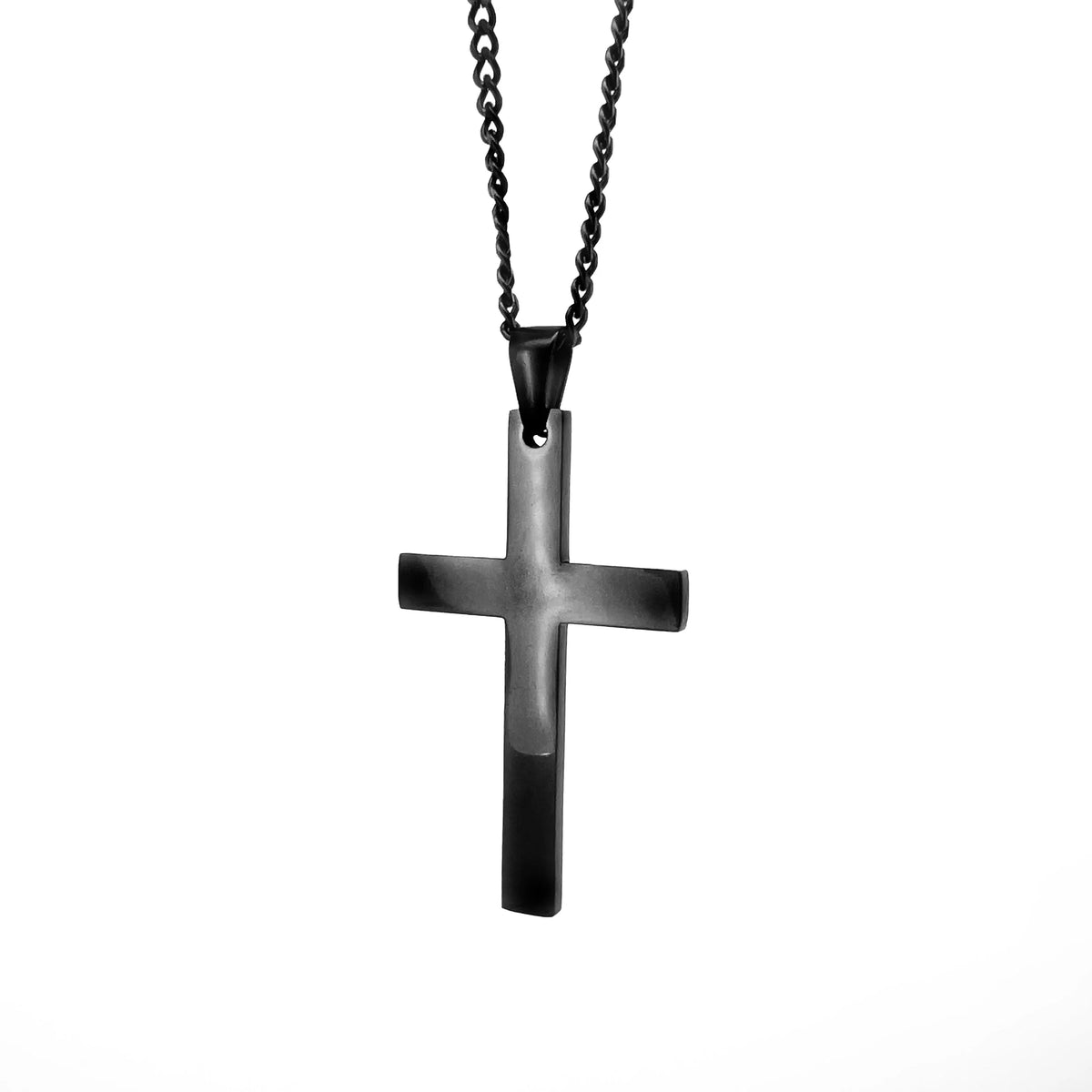 Black metal cross pendant on a chain necklace.