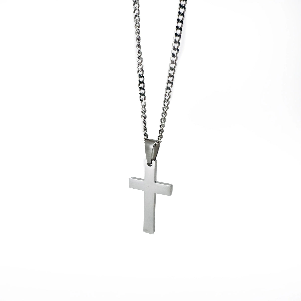 Silver cross pendant on a chain necklace.