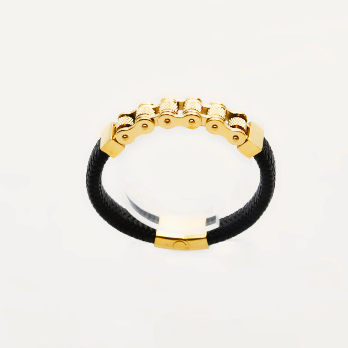 Gold and black leather bracelet with a chain-like gold centerpiece.