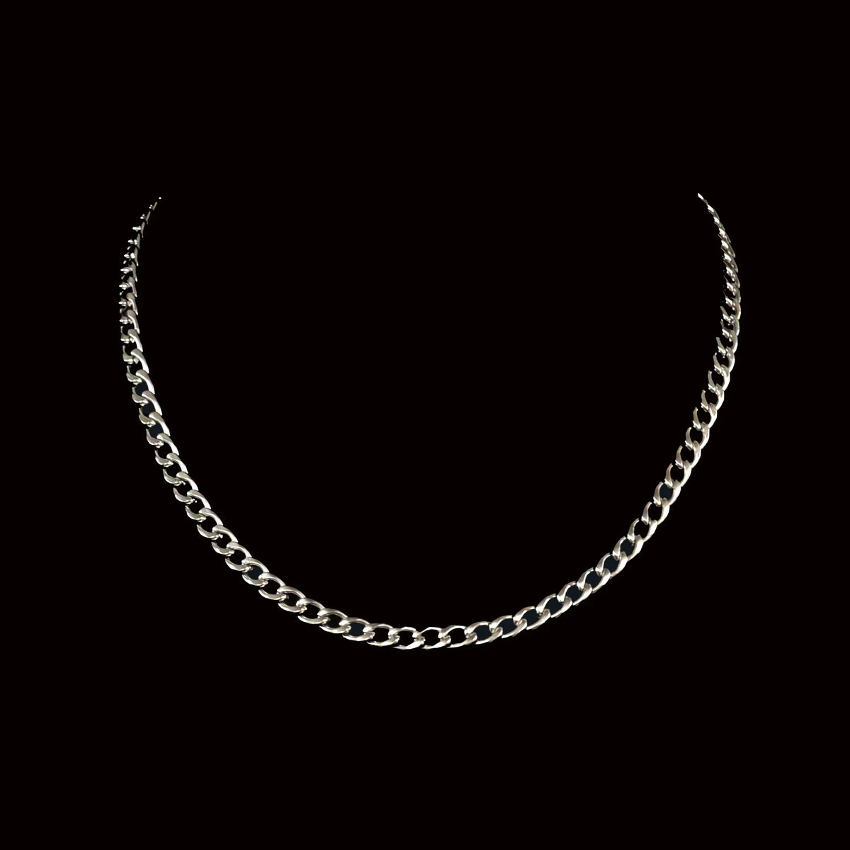 Silver chain necklace with curved curb links.