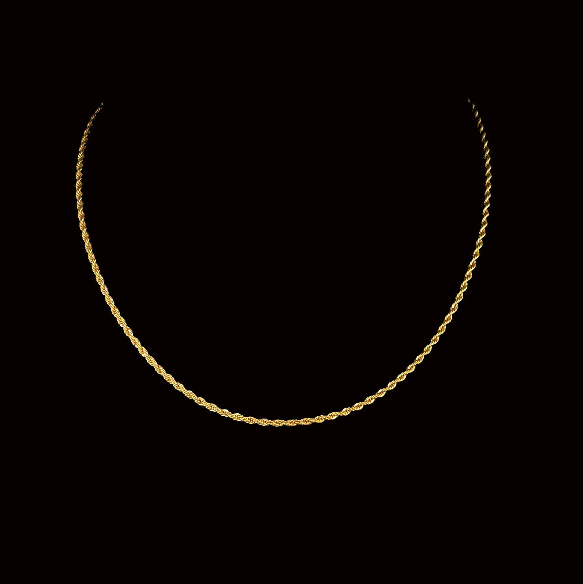 Gold rope chain necklace.