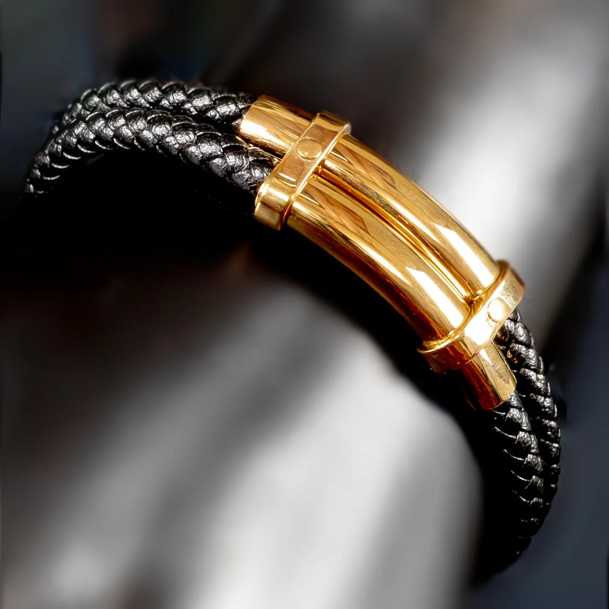 Leather bracelet with a gold-colored metal clasp.