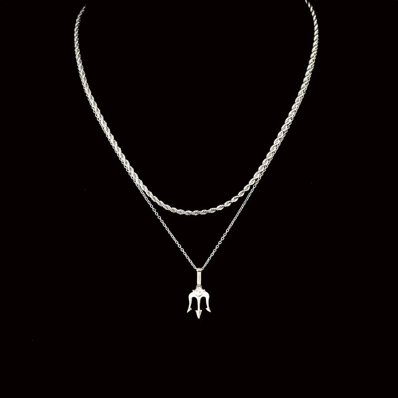 Silver necklace with a trident-shaped pendant.