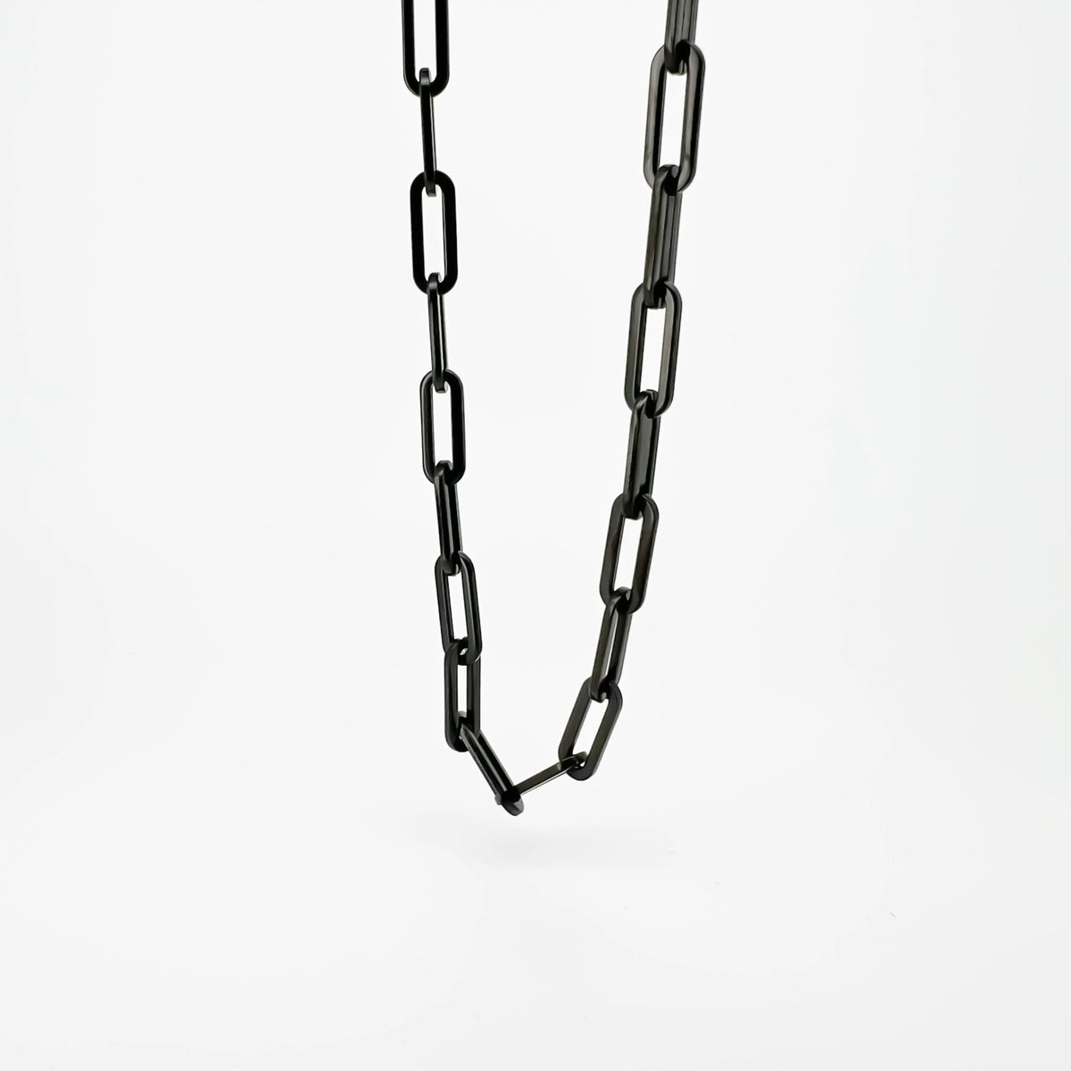 Black metal chain with elongated oval links.