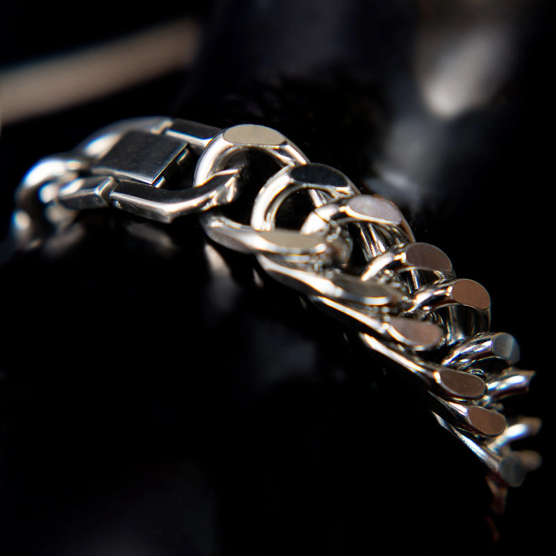 Shiny silver bracelet with interlocking chain links.