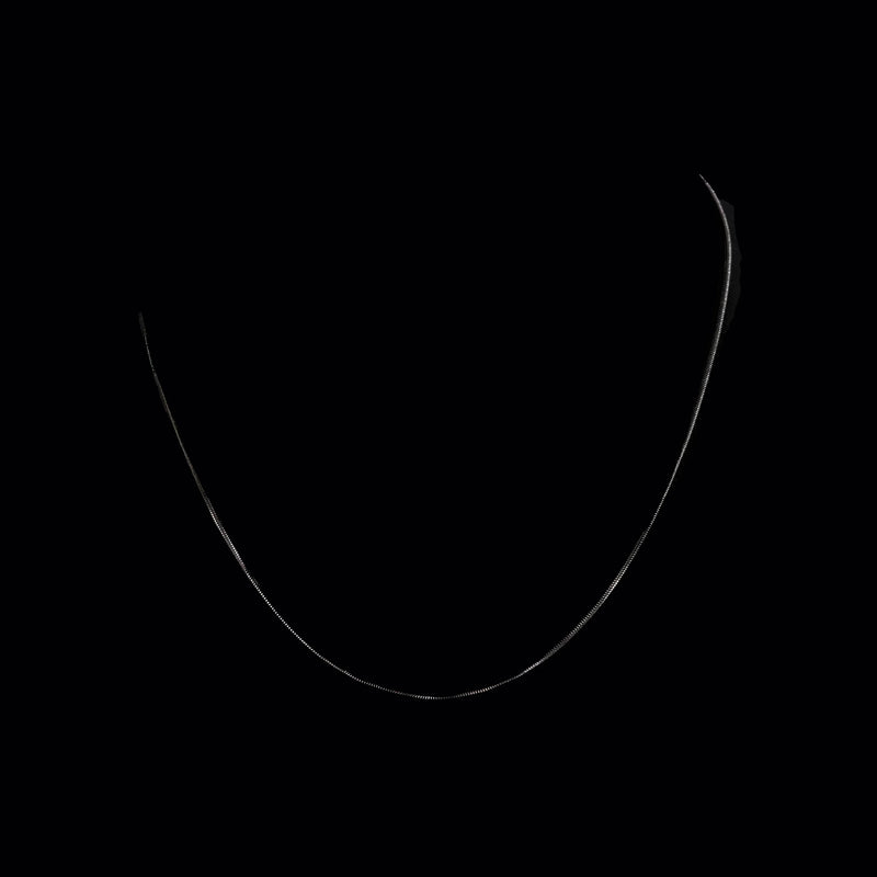 Simple curved white line forming a smile shape against a black background.