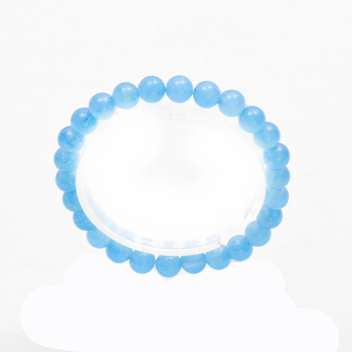 Light blue beaded bracelet with round, translucent stones.