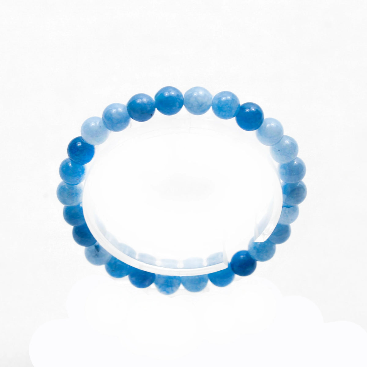 Blue beaded bracelet with varying shades of blue stones.