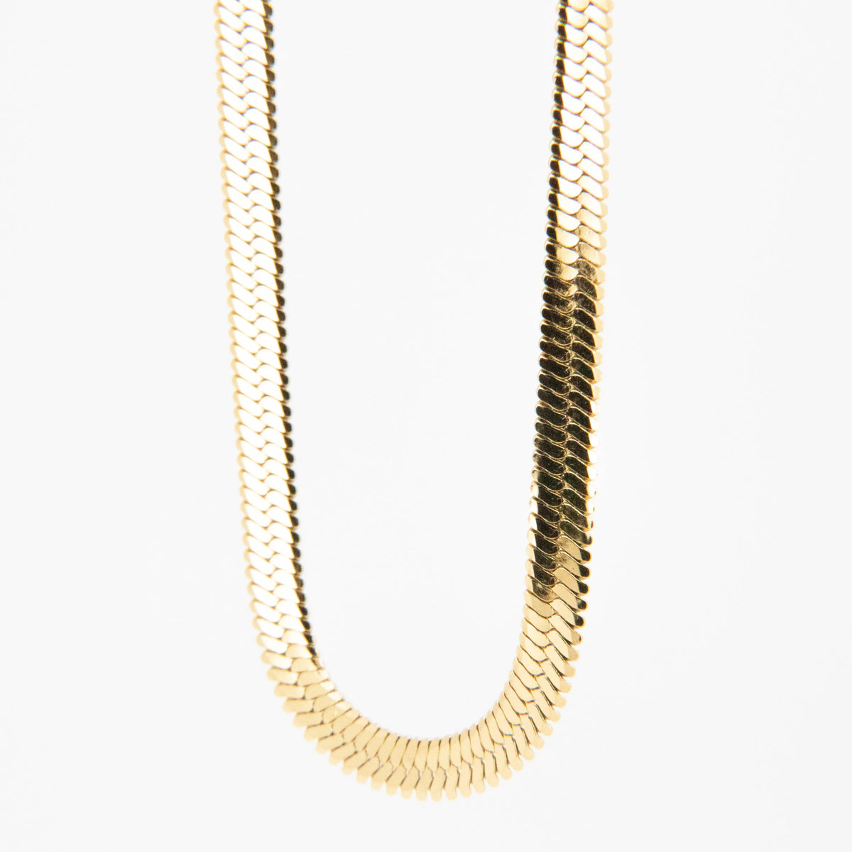 Gold-toned flat chain necklace with overlapping scale-like links.