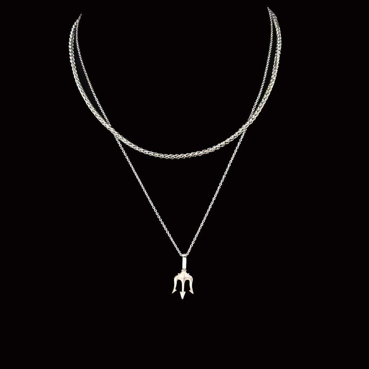 Silver layered necklace with a trident-shaped pendant.