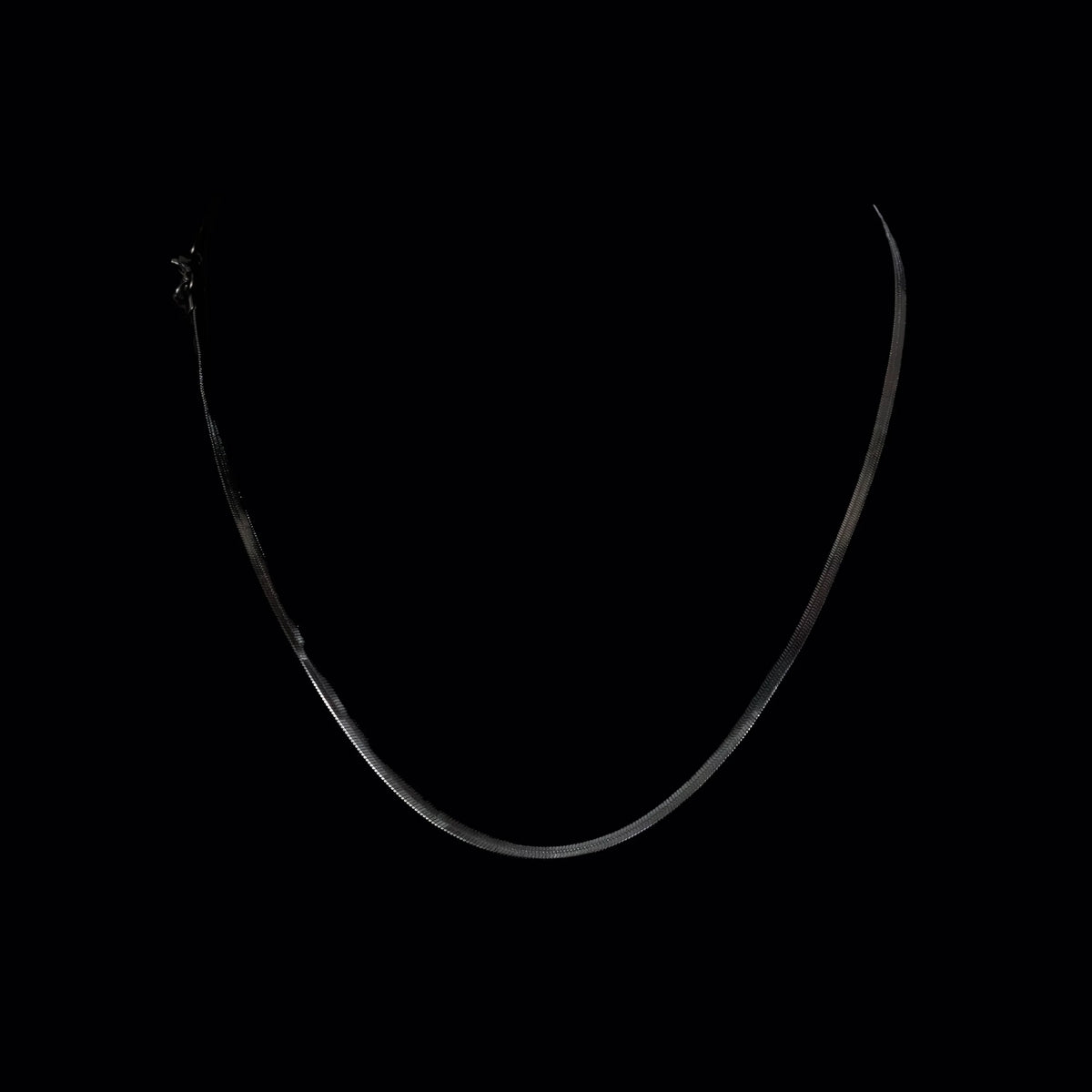 Thin curved silver line forming a U-shape against black.