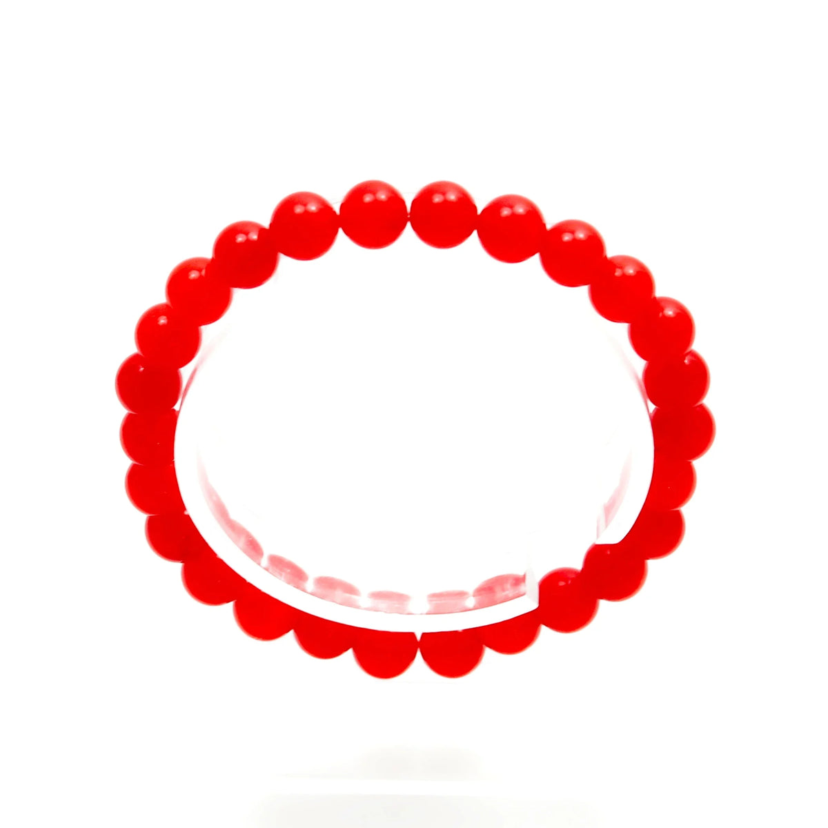 Red beaded bracelet or elastic wristband.