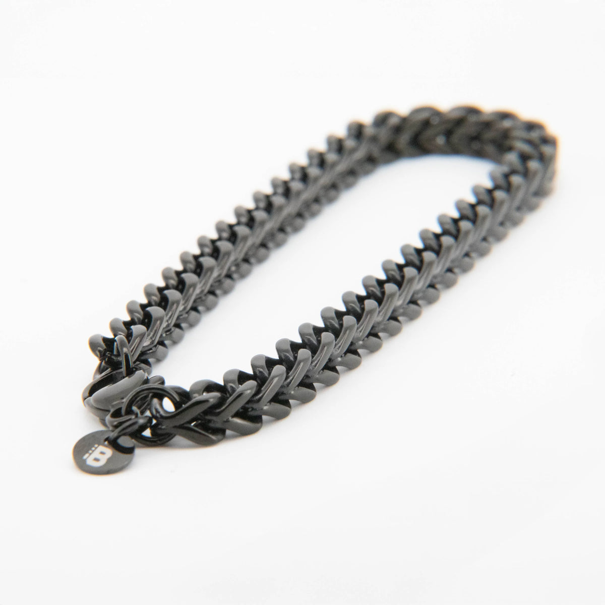 Dark metallic chain bracelet with a braided pattern.