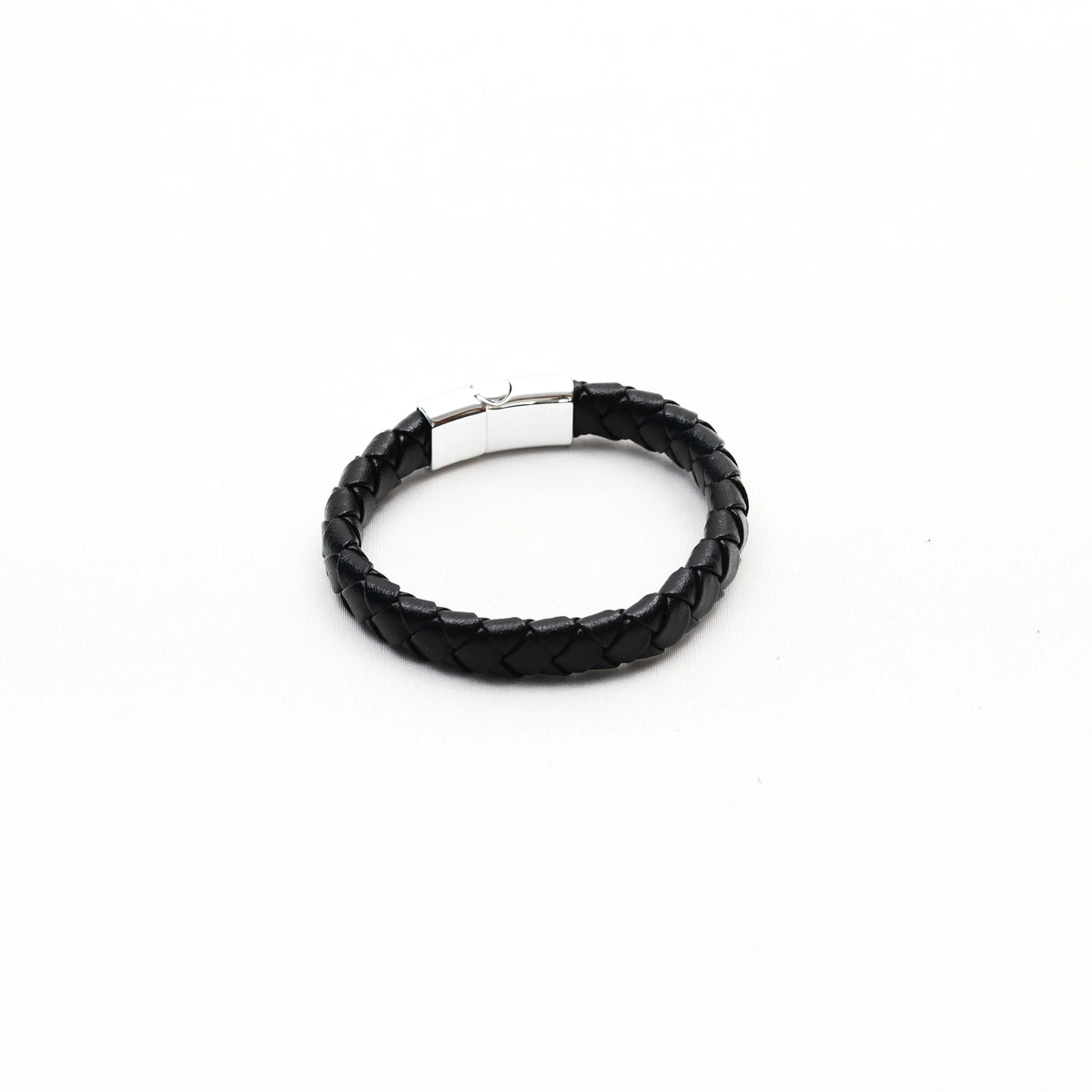 Black braided leather bracelet with a silver clasp.