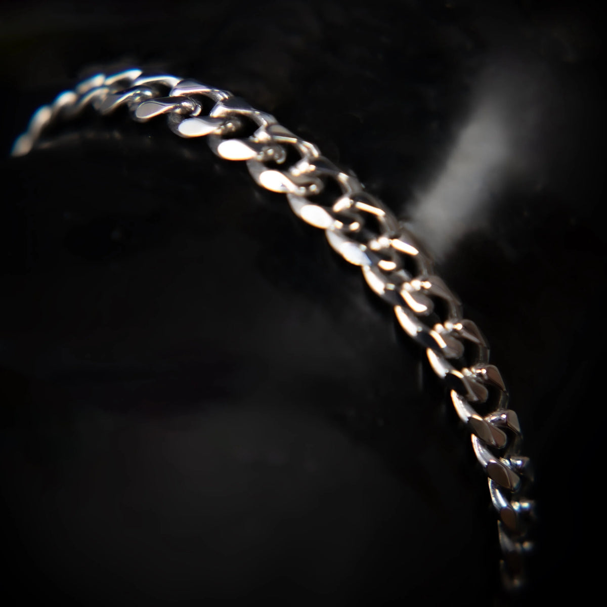 Silver chain bracelet with interlocking links.