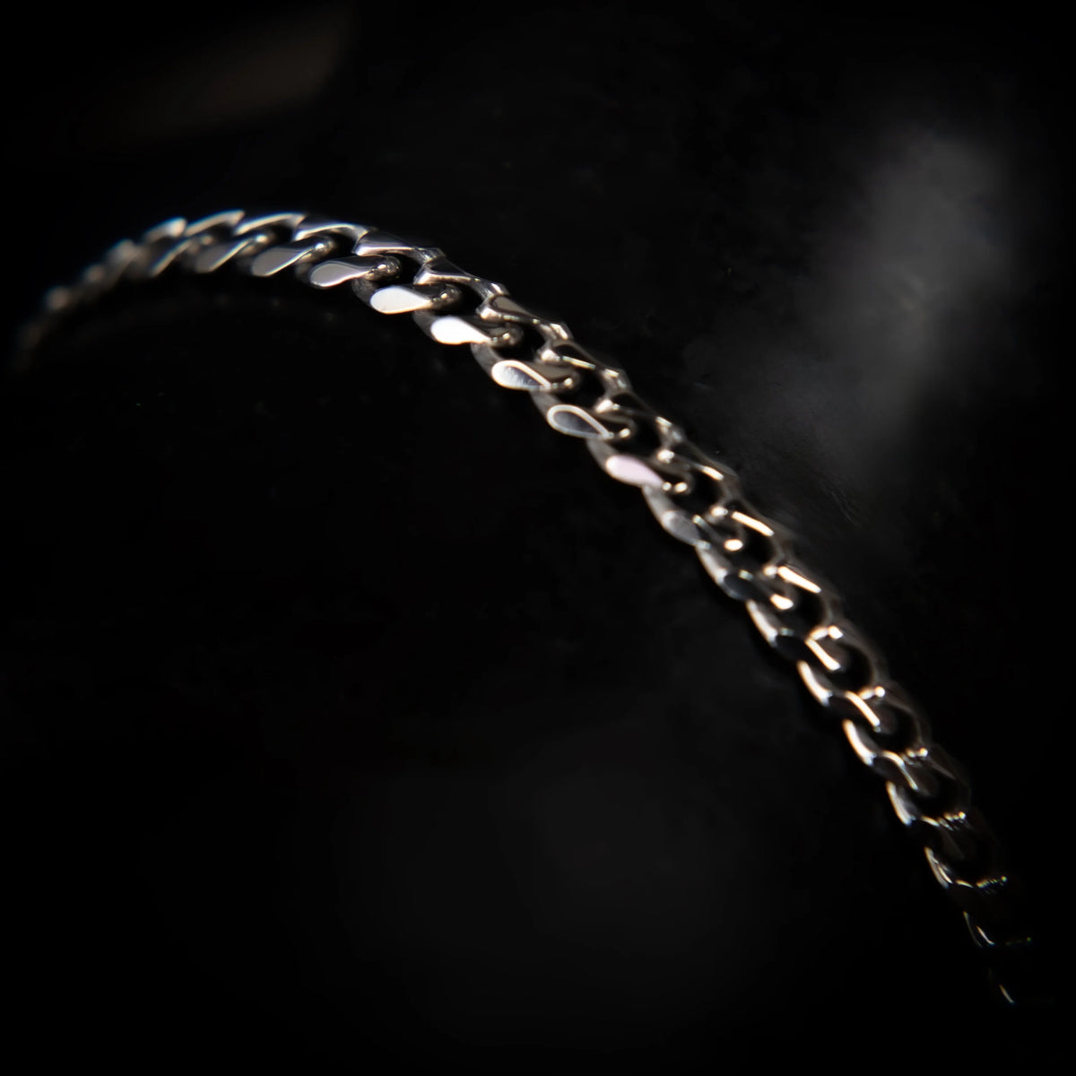 Silver chain bracelet with interlocking links.