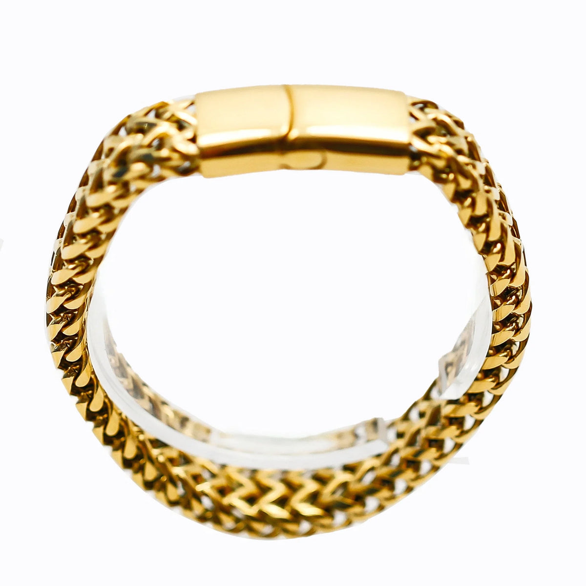 Gold chain bracelet with a smooth rectangular clasp.