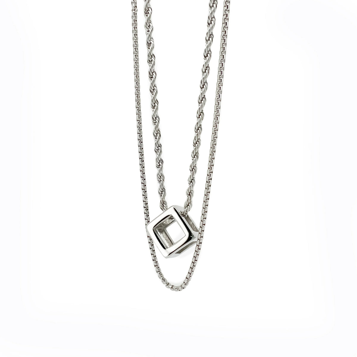 Silver double-chain necklace with a geometric cube-shaped pendant.