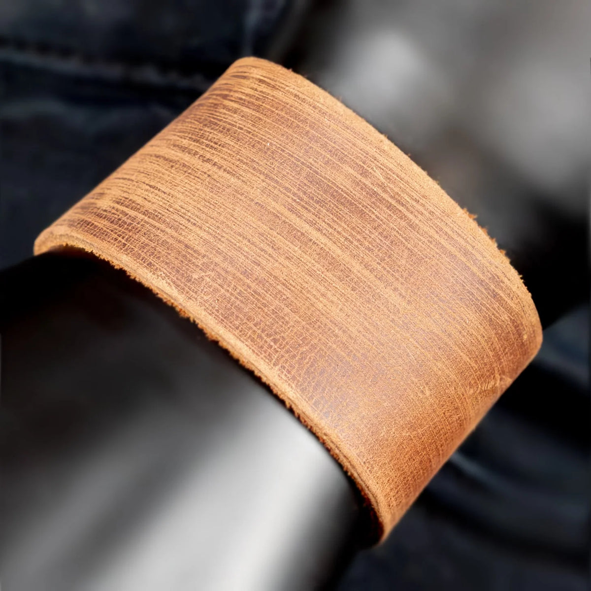 Curved piece of light-colored wood veneer with visible grain texture.