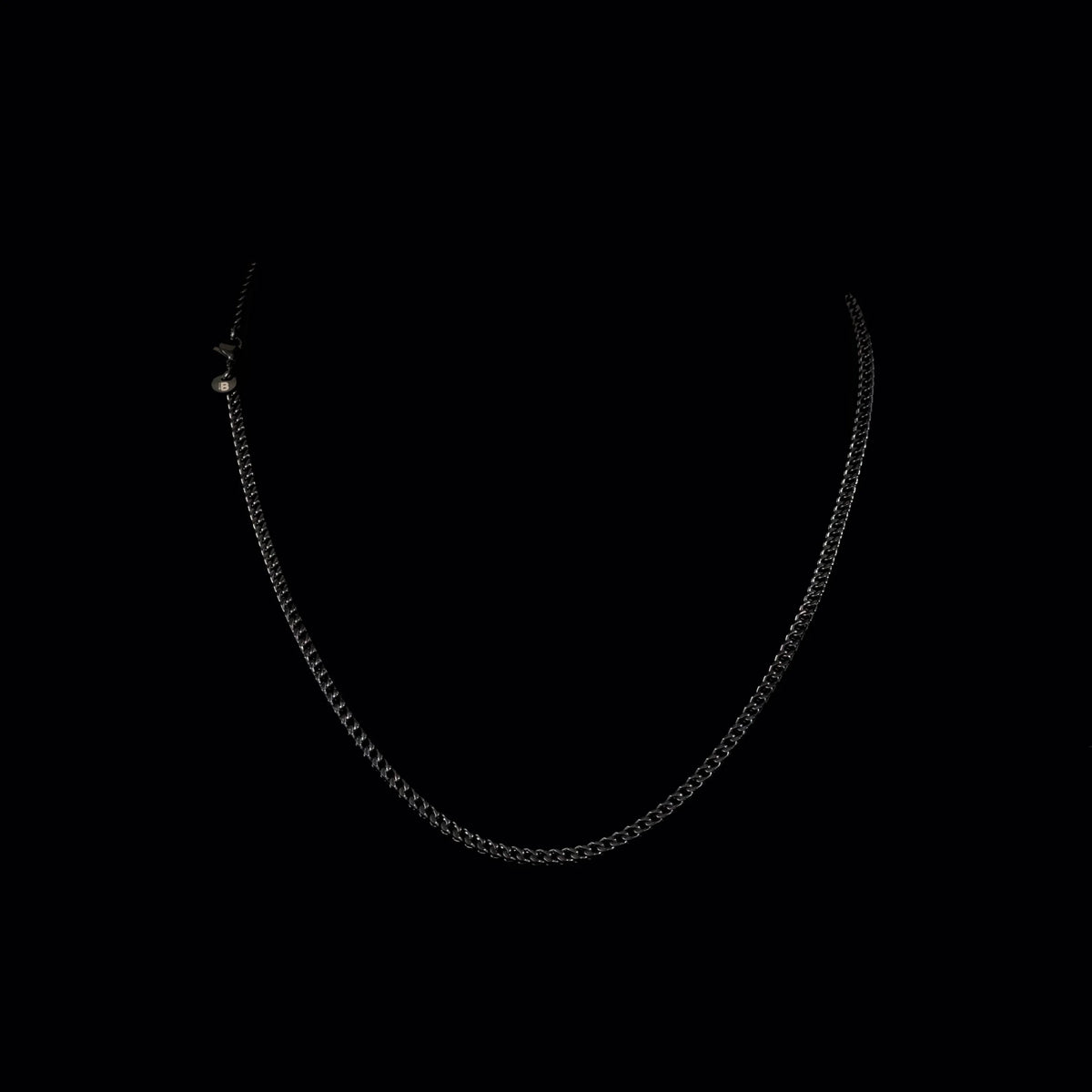 Simple silver chain necklace with small links.