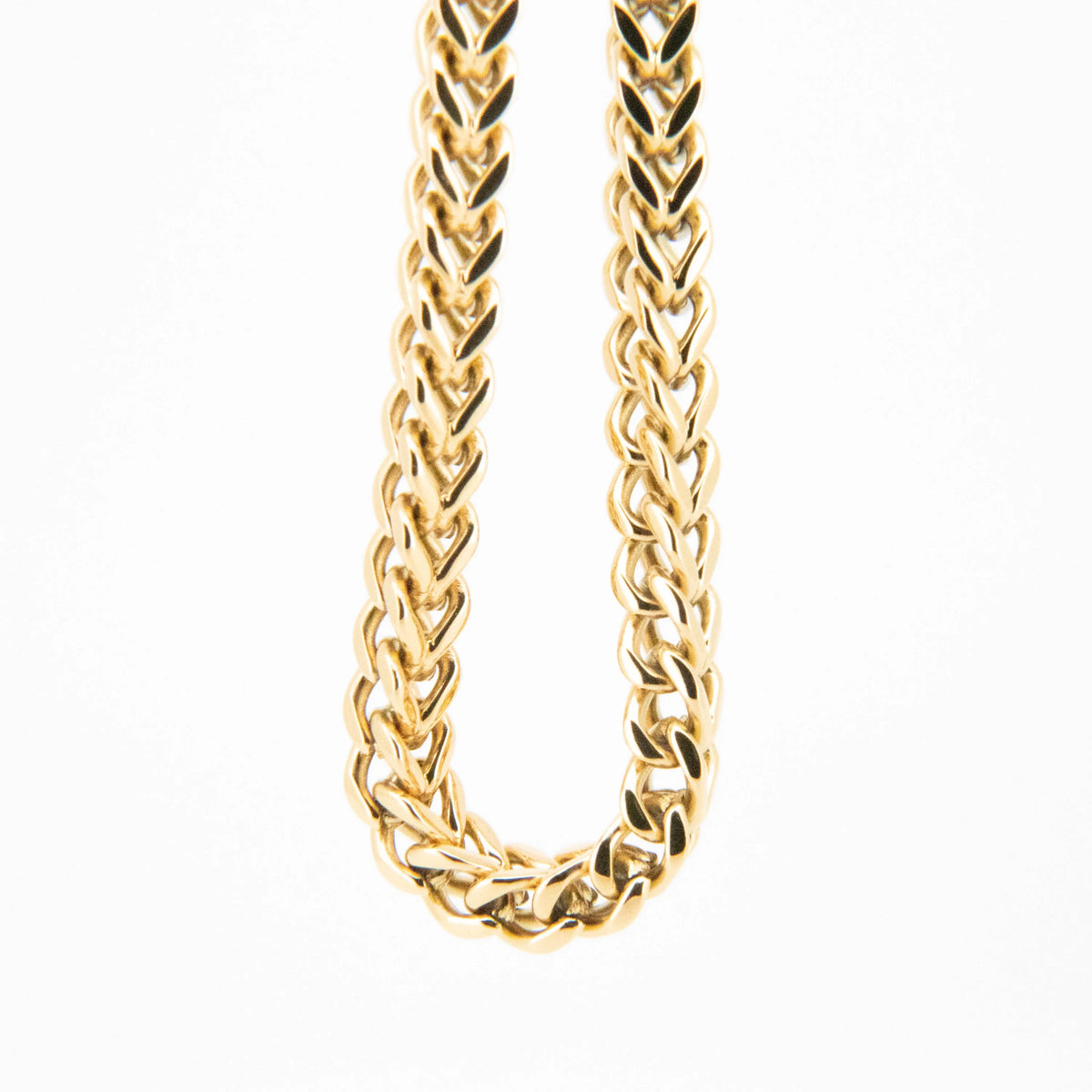 Gold chain necklace with a braided link pattern.