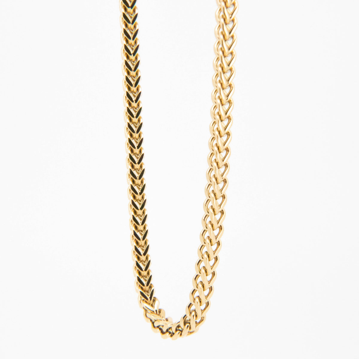 Gold chain necklace with a braided or woven pattern.