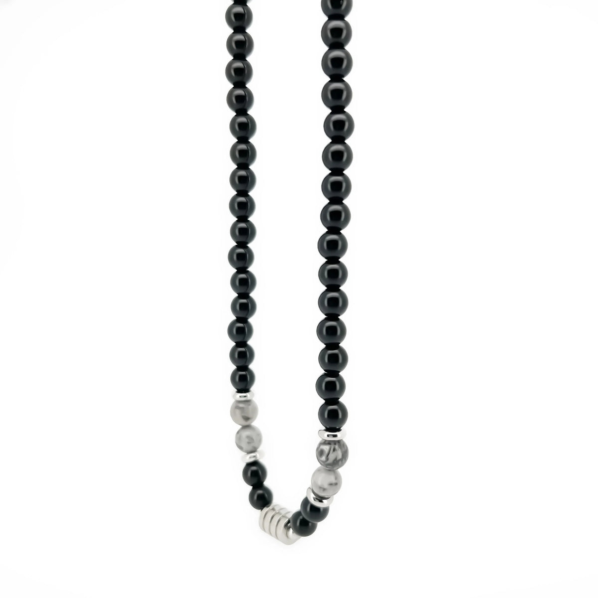 Beaded necklace with black pearls and silver accents.