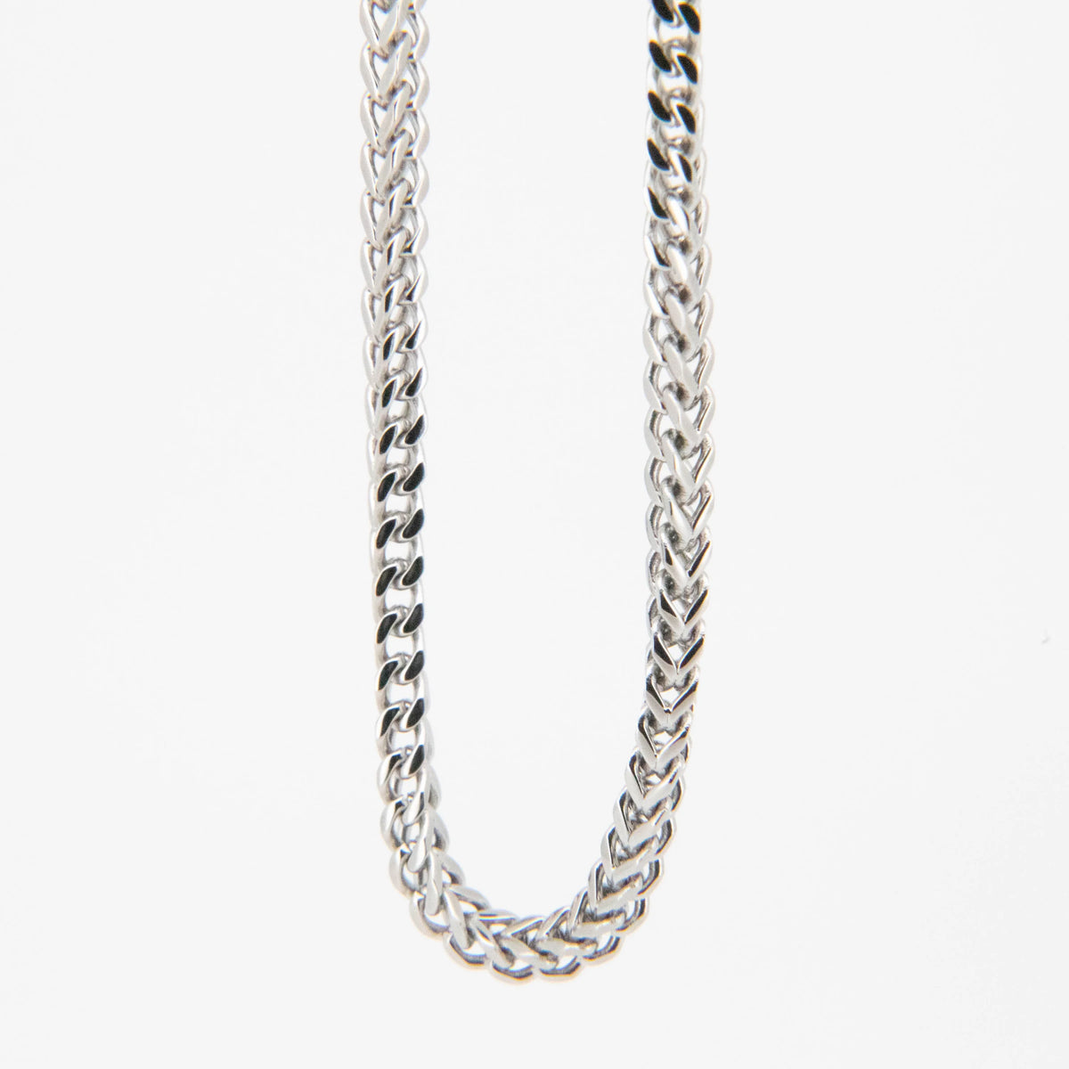 Silver braided chain necklace with an interwoven pattern.