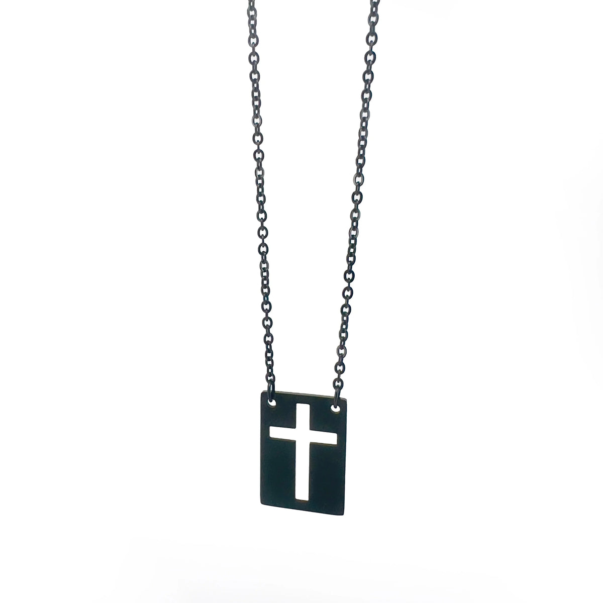 Black metal necklace with a rectangular pendant featuring a cut-out cross design.