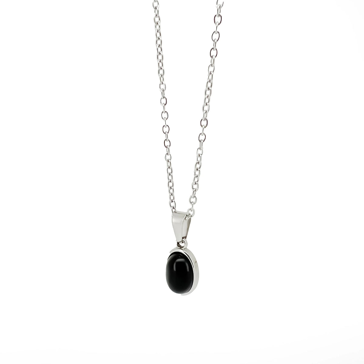 Silver necklace with an oval black stone pendant.