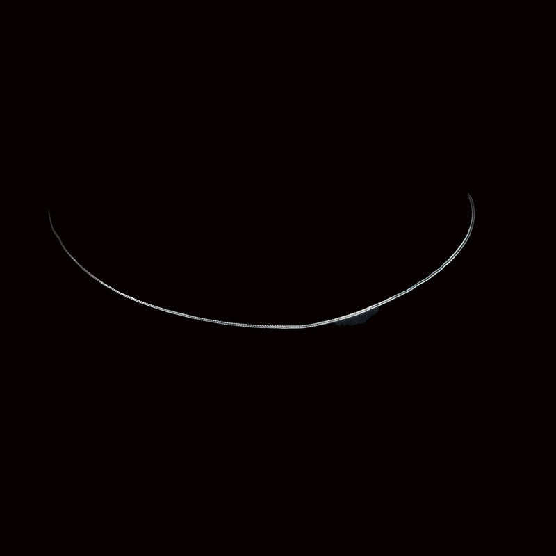 Thin crescent shape glowing against a dark background.